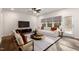 Spacious living room with comfortable seating, large TV, and access to backyard at 141 Beacon Hill Rd # 13, Lillington, NC 27546