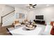 Bright living room with hardwood floors, comfortable seating, and large windows at 141 Beacon Hill Rd # 13, Lillington, NC 27546