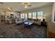 Open living room and kitchen with hardwood floors and lots of natural light at 141 Beacon Hill Rd # 13, Lillington, NC 27546