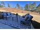 Relaxing patio area with outdoor furniture and wooded views at 141 Beacon Hill Rd # 13, Lillington, NC 27546