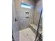 Clean shower with built-in seat and tiled walls at 141 Beacon Hill Rd # 13, Lillington, NC 27546