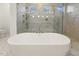 Luxurious soaking tub with marble shower at 43 Laurel Knoll Dr, Pittsboro, NC 27312