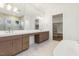Luxurious bathroom with double vanities, soaking tub, and marble shower at 43 Laurel Knoll Dr, Pittsboro, NC 27312