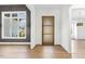 Welcoming foyer features hardwood floors, gray walls and views to the outdoors at 43 Laurel Knoll Dr, Pittsboro, NC 27312