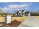Beautiful home featuring a manicured lawn, driveway, and architectural design at 43 Laurel Knoll Dr, Pittsboro, NC 27312