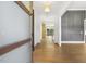 Spacious hallway featuring hardwood floors, elegant trim, and plenty of natural light at 43 Laurel Knoll Dr, Pittsboro, NC 27312