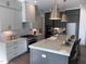 Modern kitchen with stainless steel appliances, granite countertops, an island, and pendant lighting at 43 Laurel Knoll Dr, Pittsboro, NC 27312