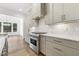 Modern kitchen features stainless steel appliances, white counters, and light gray cabinetry at 43 Laurel Knoll Dr, Pittsboro, NC 27312