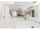 Open concept kitchen with white countertops, gold faucet, and views to living room with fireplace at 43 Laurel Knoll Dr, Pittsboro, NC 27312