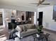 Open-concept living area with modern kitchen, comfortable seating, and stylish decor at 43 Laurel Knoll Dr, Pittsboro, NC 27312
