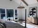 Bright main bedroom with hardwood floors, modern furniture, and large windows with natural light at 43 Laurel Knoll Dr, Pittsboro, NC 27312