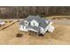 An aerial view of a two-story home with a cozy screened-in porch and lush surroundings at 125 Cotton Fields Ln # 26, Fuquay Varina, NC 27526