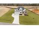 New construction home boasts a two-car garage and a mix of white siding and stone accents at 125 Cotton Fields Ln # 26, Fuquay Varina, NC 27526