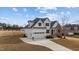 Beautiful new construction features a stone and white accent exterior, large garage and well manicured lawn at 125 Cotton Fields Ln # 26, Fuquay Varina, NC 27526