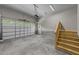 Spacious two car garage with painted floors and a side door at 125 Cotton Fields Ln # 26, Fuquay Varina, NC 27526