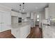 Well-equipped kitchen features white cabinets, granite countertops, and stainless steel appliances at 125 Cotton Fields Ln # 26, Fuquay Varina, NC 27526
