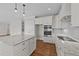 Bright kitchen with a large island, stainless steel appliances, and custom white cabinetry at 125 Cotton Fields Ln # 26, Fuquay Varina, NC 27526