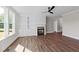 Comfortable living space with built-in shelving and cabinetry surrounding the fireplace, complemented by wood-look flooring at 125 Cotton Fields Ln # 26, Fuquay Varina, NC 27526