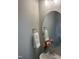 Modern half bathroom with stylish mirror and vanity, adding a touch of elegance to the home at 98 Prency Ln, Middlesex, NC 27557