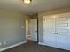 Bedroom featuring neutral walls, plush carpeting, closet and access to the other rooms in the house at 98 Prency Ln, Middlesex, NC 27557