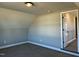 Cozy bedroom featuring plush carpeting, neutral walls, and ample natural light through a window at 98 Prency Ln, Middlesex, NC 27557