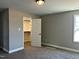 Bedroom featuring neutral walls, plush carpeting, closet and a window with natural light at 98 Prency Ln, Middlesex, NC 27557