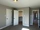 Bedroom featuring neutral walls, plush carpeting, closet and access to the other rooms in the house at 98 Prency Ln, Middlesex, NC 27557