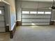Spacious garage with two garage doors and brick foundation, offering ample room for vehicles and storage at 98 Prency Ln, Middlesex, NC 27557