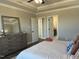 Relaxing main bedroom featuring a dresser and access to a walk-in closet and bathroom at 98 Prency Ln, Middlesex, NC 27557