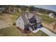 Aerial view of beautiful two-story home with landscaping and concrete driveway at 27 Prency Ln, Middlesex, NC 27557