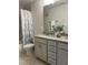 Bathroom features a granite vanity and shower with decorative curtain at 27 Prency Ln, Middlesex, NC 27557