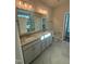 Bright bathroom features a double vanity with granite countertop and modern fixtures at 27 Prency Ln, Middlesex, NC 27557