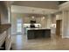 Modern kitchen features stainless appliances, a large central island, and ample cabinet space at 27 Prency Ln, Middlesex, NC 27557