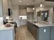 Spacious kitchen boasts stainless steel appliances, granite countertops, and a large island with a sink at 27 Prency Ln, Middlesex, NC 27557