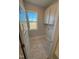 Well-lit laundry room with cabinet storage space and a window providing natural light at 27 Prency Ln, Middlesex, NC 27557