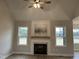 Inviting living room with fireplace and large windows offers natural light and comfort at 27 Prency Ln, Middlesex, NC 27557
