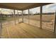 Screened-in porch with wood flooring overlooking the backyard at 27 Prency Ln, Middlesex, NC 27557