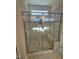 New shower showcasing glass door and tile surround with built-in seat at 27 Prency Ln, Middlesex, NC 27557