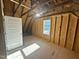 Unfinished room with exposed wood frame and abundant natural light at 27 Prency Ln, Middlesex, NC 27557
