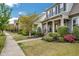 Charming homes line a sidewalk with manicured lawns, creating a welcoming neighborhood street view at 901 Wildflower Ridge Rd, Wake Forest, NC 27587