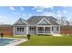 Backyard view showcasing a screened-in porch and a beautiful swimming pool, perfect for relaxation at 262 Hook Dr # 12, Fuquay Varina, NC 27526