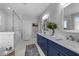Bright bathroom featuring a double vanity with marble countertops and a walk-in glass shower at 262 Hook Dr # 12, Fuquay Varina, NC 27526