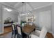 Bright dining room featuring a modern chandelier and stylish decor at 262 Hook Dr # 12, Fuquay Varina, NC 27526