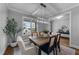 Dining room with elegant lighting fixture, hardwood floors, and large window at 262 Hook Dr # 12, Fuquay Varina, NC 27526