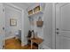 Stylish entryway with bench, coat rack, and doorway to a half bathroom featuring a blue vanity at 262 Hook Dr # 12, Fuquay Varina, NC 27526