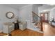 Inviting foyer with hardwood floors, staircase, and elegant decor at 262 Hook Dr # 12, Fuquay Varina, NC 27526