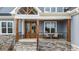 Inviting front porch with a seating area and a beautiful double-door entrance at 262 Hook Dr # 12, Fuquay Varina, NC 27526