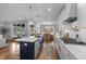 Open concept kitchen with island seating and stainless appliances connects seamlessly to the dining area at 262 Hook Dr # 12, Fuquay Varina, NC 27526