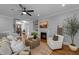 Open-concept living area with fireplace, hardwood floors, and plenty of natural light at 262 Hook Dr # 12, Fuquay Varina, NC 27526