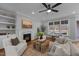 Comfortable living room with a fireplace, large windows, and ample seating for relaxation and entertainment at 262 Hook Dr # 12, Fuquay Varina, NC 27526